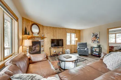 a living room with a couch and a tv at Less Than half Mi to Marina Grand Lake Getaway! in Grand Lake