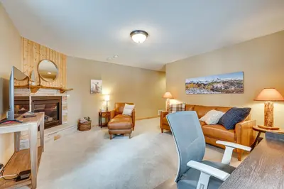 a living room with a couch and a fireplace at Less Than half Mi to Marina Grand Lake Getaway! in Grand Lake