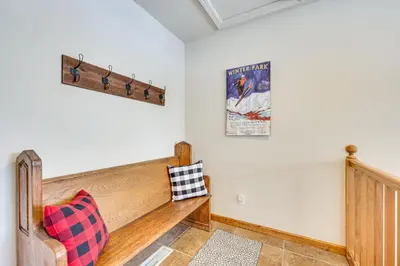 a room with a bench and a poster on the wall at Less Than half Mi to Marina Grand Lake Getaway! in Grand Lake
