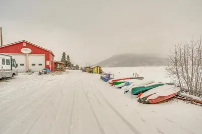 a row of boats are lined up in the snow at Less Than half Mi to Marina Grand Lake Getaway! in Grand Lake