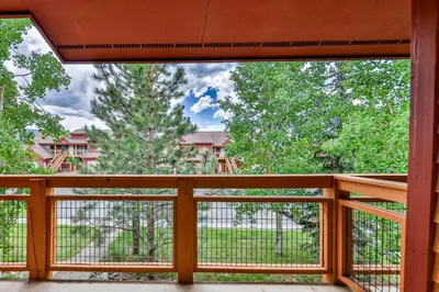 a balcony with a view of a tree at Mountain Vista in Fraser