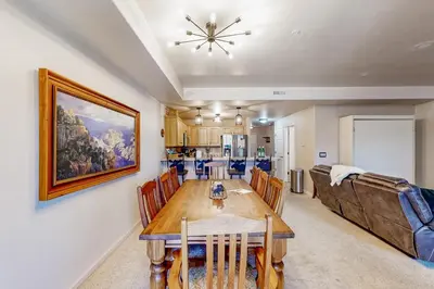 a dining room with a table and a couch at Mountain Vista in Fraser