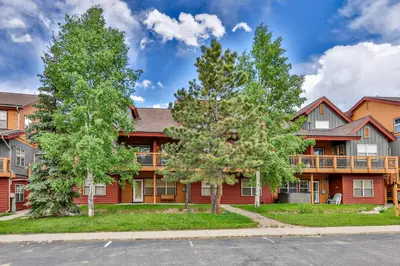 a large red building with trees in front of it at Mountain Vista in Fraser