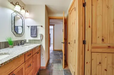 a bathroom with a sink and a mirror at Colorado Condo about 2 Mi to Winter Park Resort! in Winter Park