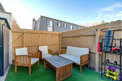 a patio with chairs and a table and a fence at Comfy Family-size Townhome 2BR-5 People near Old town Arvada-10min walk in Arvada