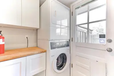 a white laundry room with a washer and dryer at Comfy Family-size Townhome 2BR-5 People near Old town Arvada-10min walk in Arvada
