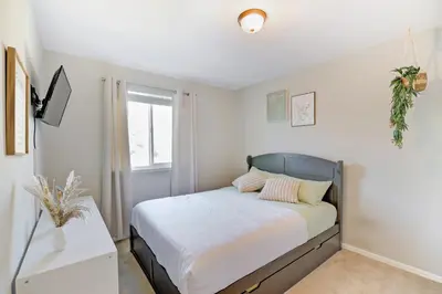 a bedroom with a bed and a window at Comfy Family-size Townhome 2BR-5 People near Old town Arvada-10min walk in Arvada