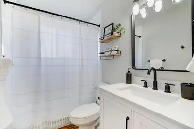 a white bathroom with a toilet and a sink at Comfy Family-size Townhome 2BR-5 People near Old town Arvada-10min walk in Arvada