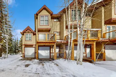 a large house with snow on the ground at Cabin Sweet Cabin in Winter Park