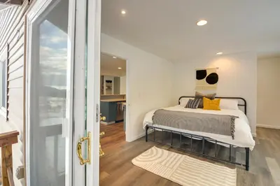 a bedroom with a bed and a sliding glass door at 6 Mi to Staunton State Park Conifer Home with Deck in Conifer