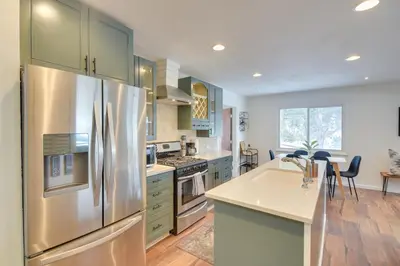a large kitchen with a stainless steel refrigerator at 6 Mi to Staunton State Park Conifer Home with Deck in Conifer