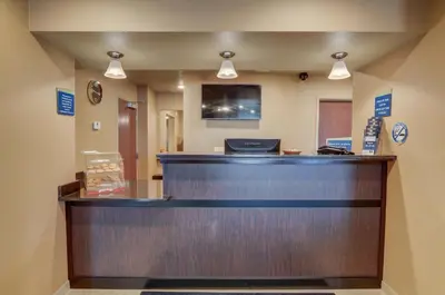a reception counter at a hospital with avertisement at Cobblestone Inn & Suites-Kersey in Kersey