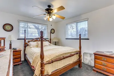 a bedroom with a bed and a ceiling fan at Dog-Friendly Denver Apartment with Shared Yard! in Denver