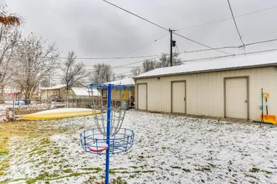 a basket in the snow next to a playground at Dog-Friendly Denver Apartment with Shared Yard! in Denver