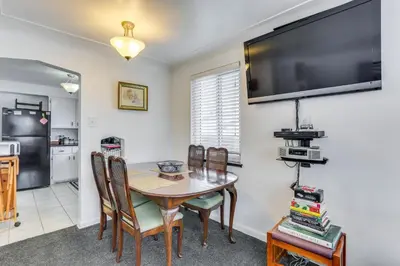 a kitchen and dining room with a table and chairs at Dog-Friendly Denver Apartment with Shared Yard! in Denver