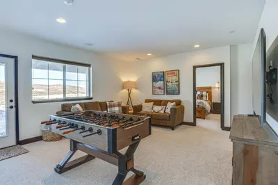a living room with a ping pong table at Half-Mi to Skiing Gorgeous Granby Ranch Home! in Granby