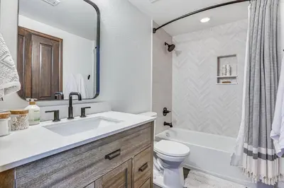 a bathroom with a sink and a tub and a toilet at Half-Mi to Skiing Gorgeous Granby Ranch Home! in Granby