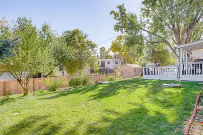 a yard with a white fence and a yard sidx sidx sidxktopktop at 4 Mi to Hwy Access for Mtn Fun Family Getaway! in Lakewood