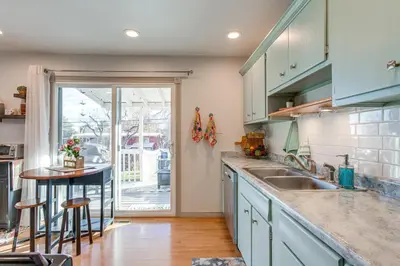 a kitchen with blue cabinets and a counter top at 4 Mi to Hwy Access for Mtn Fun Family Getaway! in Lakewood