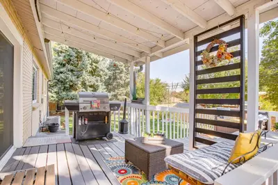 a screened porch with a stove and a grill at 4 Mi to Hwy Access for Mtn Fun Family Getaway! in Lakewood