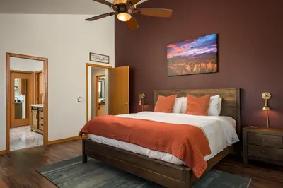 a bedroom with a bed and a ceiling fan at Stay in Evergreen - Denver Mountain Escape in Evergreen