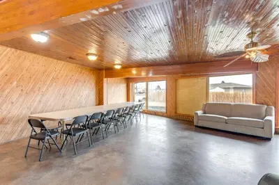 a conference room with a long table and chairs at 5 Mi to Dtwn Denver Pet-Friendly Home with Patio in Denver