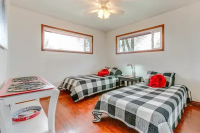 a room with two beds and a table and two windows at 5 Mi to Dtwn Denver Pet-Friendly Home with Patio in Denver