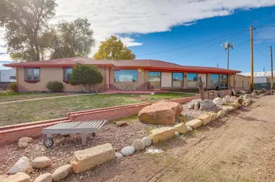 a house with a bench in front of it at 5 Mi to Dtwn Denver Pet-Friendly Home with Patio in Denver