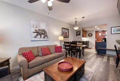 a living room with a couch and a table at Premium Unit 4373- Fraser Crossing Founders Pointe condo in Winter Park