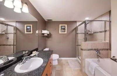 a bathroom with a sink and a tub and a toilet at Premium Unit 4373- Fraser Crossing Founders Pointe condo in Winter Park