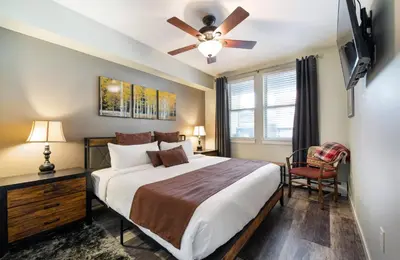 a bedroom with a bed and a ceiling fan at Premium Unit 4373- Fraser Crossing Founders Pointe condo in Winter Park