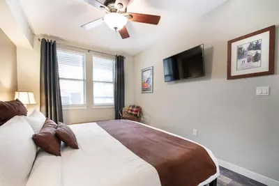 a bedroom with a bed and a ceiling fan at Premium Unit 4373- Fraser Crossing Founders Pointe condo in Winter Park