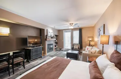 a living room with a bed and a tv at Premium Unit 4371- Fraser Crossing Founders Pointe condo in Winter Park