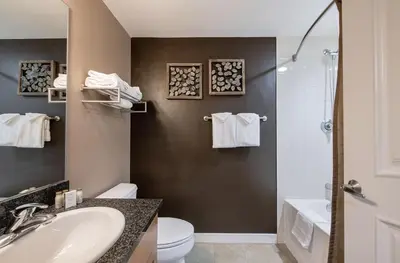 a bathroom with a sink and a toilet and a shower at Premium Unit 4371- Fraser Crossing Founders Pointe condo in Winter Park