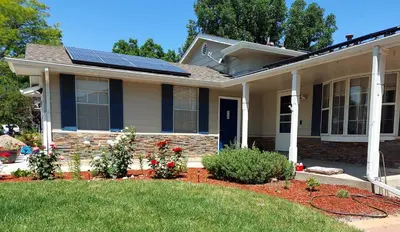 a house with solar panels on the roof at Broomfield Home in Broomfield