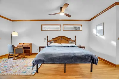 a bedroom with a bed and a ceiling fan at Beautiful Historic House in Central Longmont in Longmont