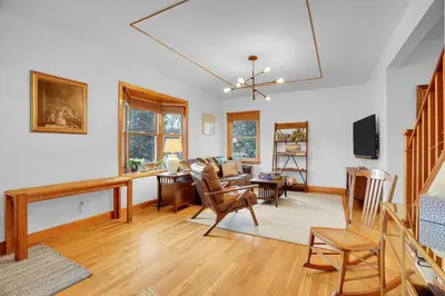 a living room with a couch and a table at Beautiful Historic House in Central Longmont in Longmont