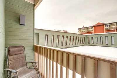 a chair sitting on the balcony of a house at Easy Ski Shuttle Access! Winter Park Mtn Getaway in Winter Park