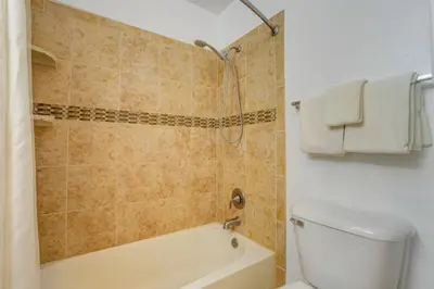 a bathroom with a shower and a toilet and a tub at Easy Ski Shuttle Access! Winter Park Mtn Getaway in Winter Park