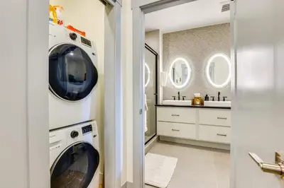 a laundry room with a washer and dryer and a sink at Downtown Winter Park Condo 3 Mi to Slopes! in Winter Park