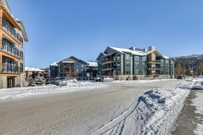 an empty street in a town in the snow at Downtown Winter Park Condo 3 Mi to Slopes! in Winter Park