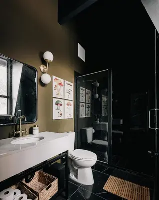a bathroom with a toilet and a sink and a shower at Modern A-Frame - Mountain Views - Evergreen in Evergreen