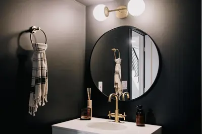 a bathroom with a sink and a mirror at Modern A-Frame - Mountain Views - Evergreen in Evergreen