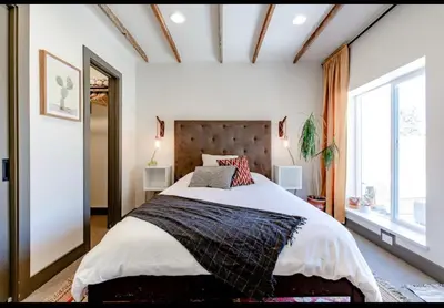 a bedroom with a large bed and a large window at Unique Denver Designer Home 3 Bed 3 Bath in Denver