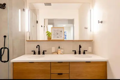 a bathroom with two sinks and a mirror at Unique Denver Designer Home 3 Bed 3 Bath in Denver
