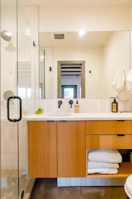 a bathroom with a sink and a mirror at Unique Denver Designer Home 3 Bed 3 Bath in Denver