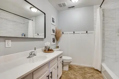 a bathroom with a sink and a toilet and a tub at Enjoy Deck and Mtn Views Grand Lake Retreat! in Grand Lake