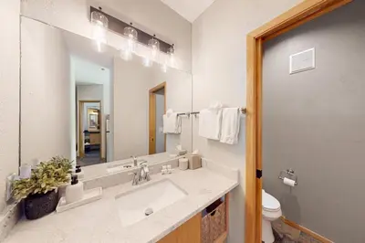 a bathroom with a sink and a mirror at River Run Sanctuary in Keystone