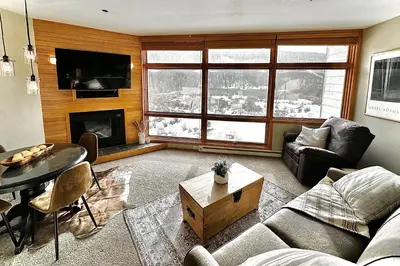 a living room with a couch and a table at River Run Sanctuary in Keystone