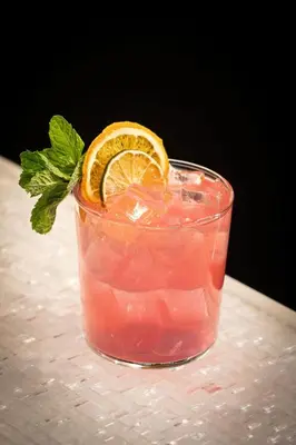 a drink with an orange slice on a table at Aloft Denver Downtown in Denver